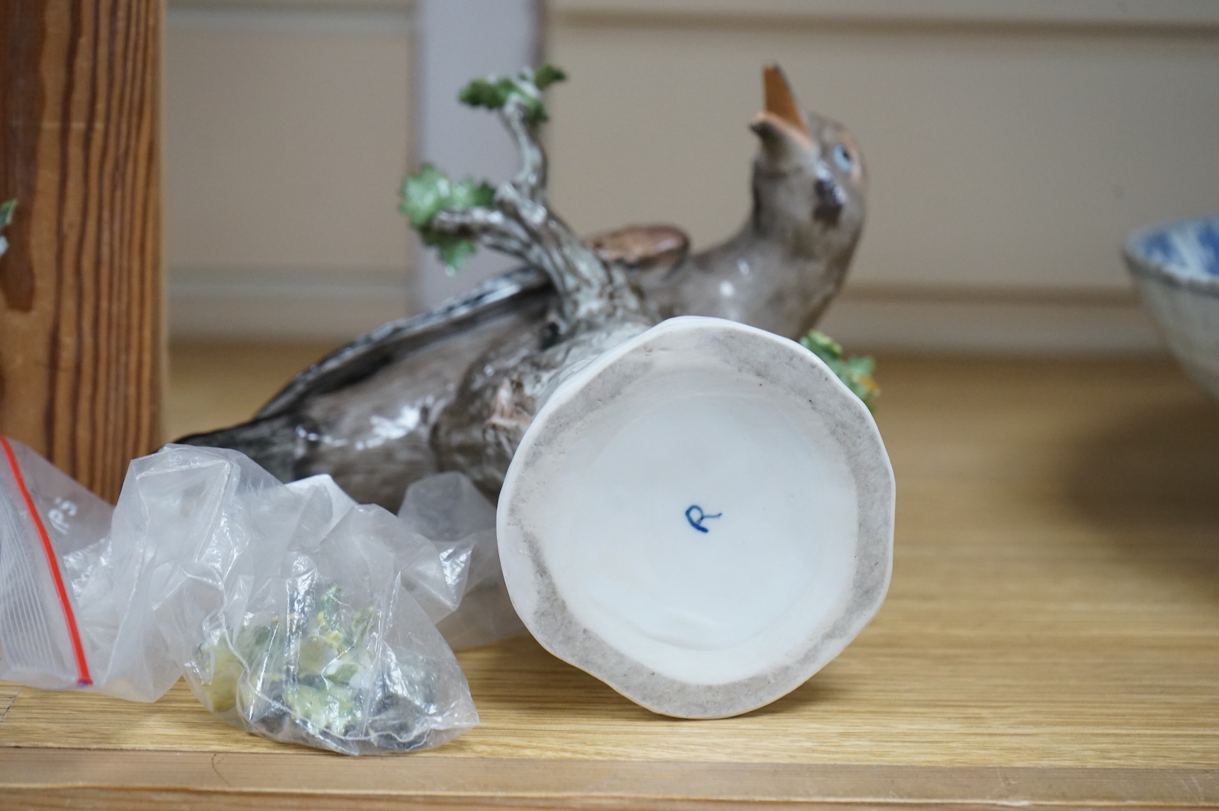 A pair of Meissen style porcelain models of Jays, 18cm